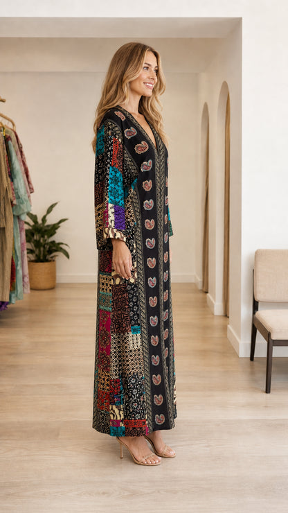 Model wearing black boho paisley patchwork maxi kaftan dress side view