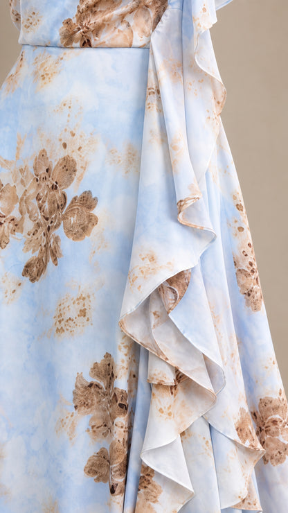Close-up of the powder blue floral print and layered ruffle detail
