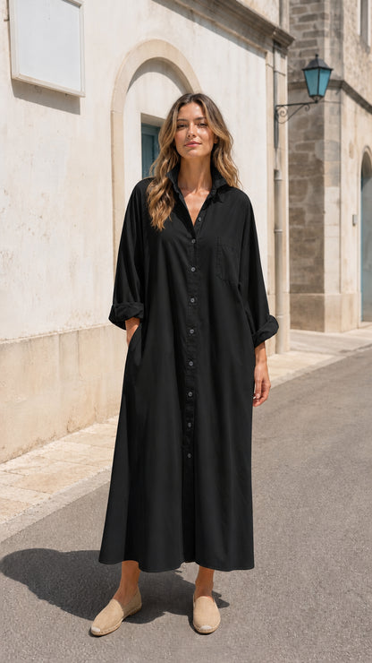 Front view of woman wearing black long sleeve button-down maxi shirt dress