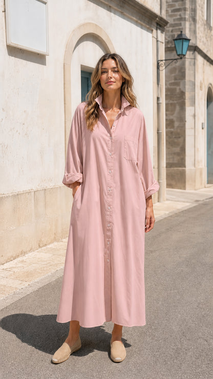 Front view of woman wearing pink long sleeve button-down maxi shirt dress